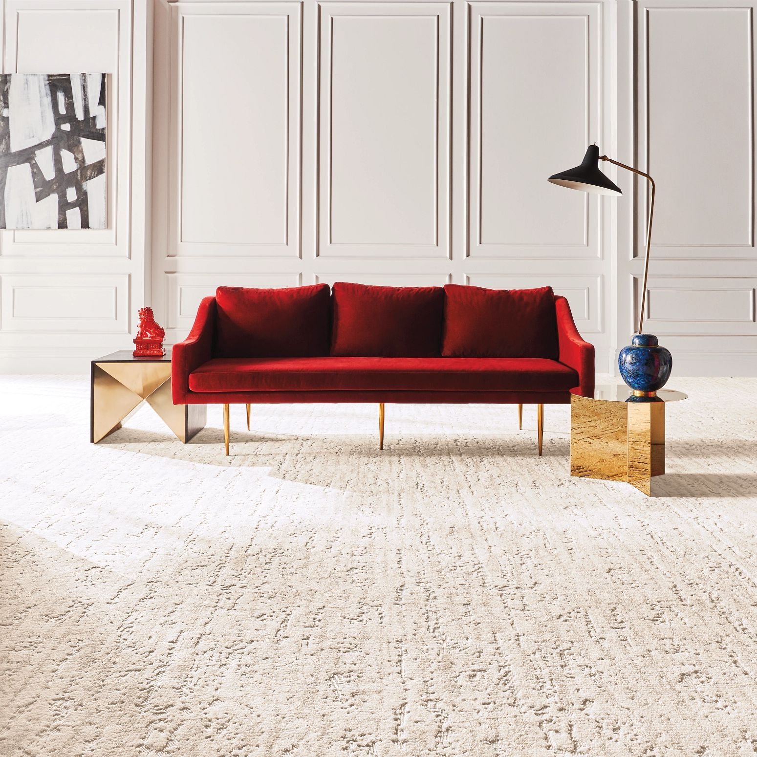 Bright living room with red velvet couch and beige textured carpet from 180 Degree Floors in the Nashville, TN area