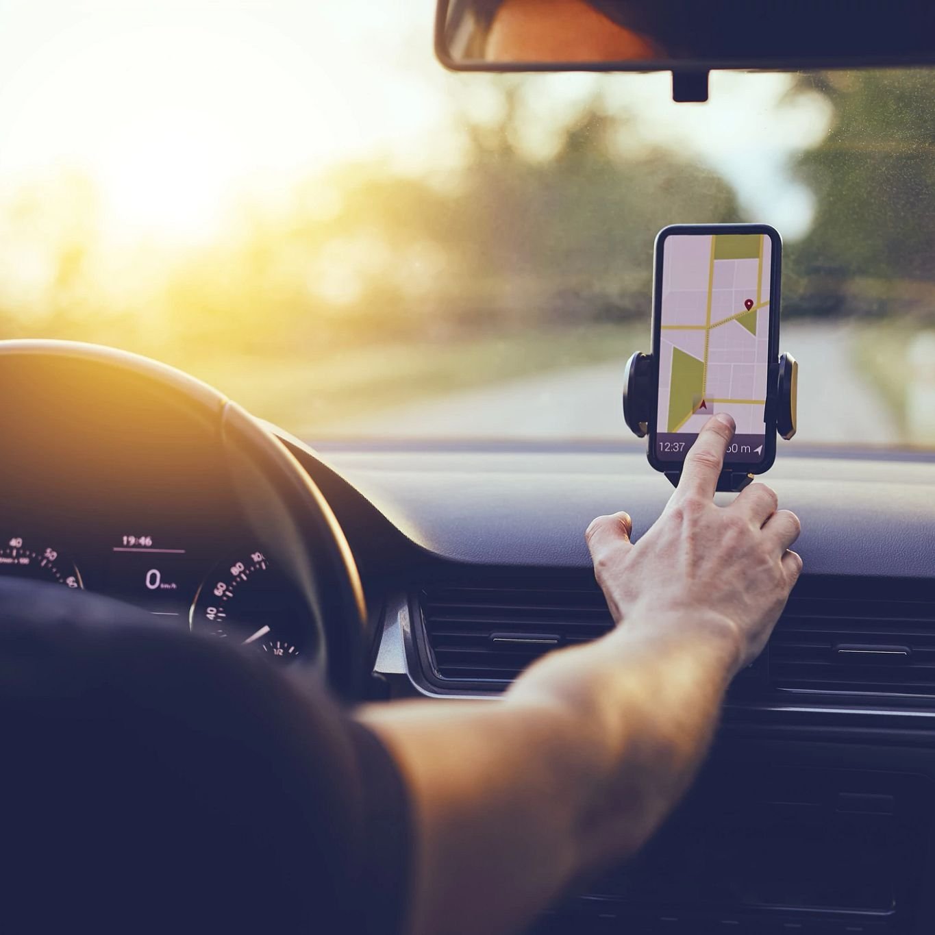 Person using smartphone for navigation while driving - 180 Degree Floors in the Nashville, TN area